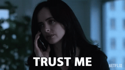 Woman Talking On Cell Phone With Trust Me Behind Her GIF