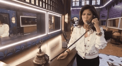 Woman Talking On Old-Fashioned Phone In Mirror GIF