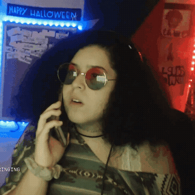 Woman Talking On Phone Halloween Sign GIF