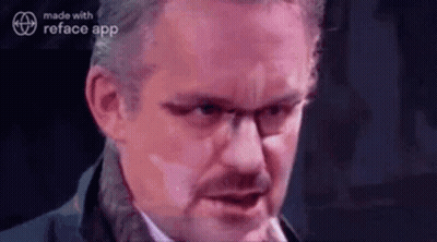 Woman Talking On Phone Looking In Mirror GIF