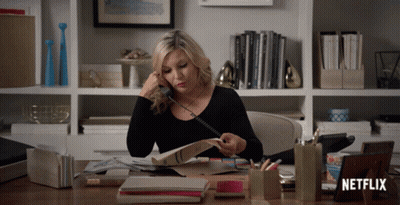 Woman Talking On Phone With Netflix Logo GIF