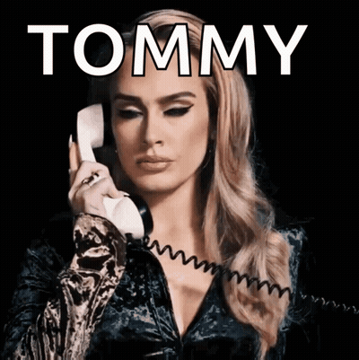 Woman Talking On Phone With Tommy Above GIF