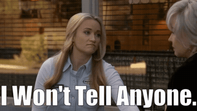 Woman Talking to Another Woman Saying I Won't Tell Anyone