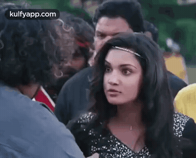 Woman Talking to Man in Crowd
