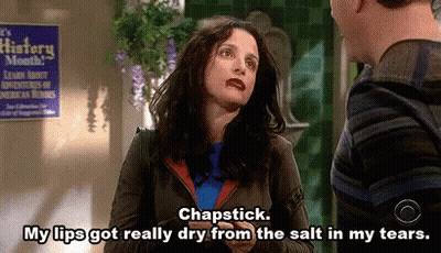 Woman Talking To Man In Front Of History Month Sign GIF