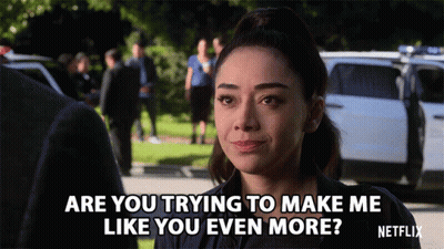 Woman Talking To Man In Front Of Police Car Says Are You Trying To Make Me Like You Even More GIF