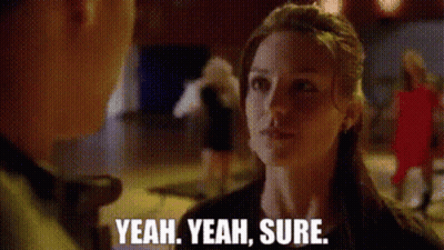 Woman Talking To Man Saying Yeah Yeah Sure GIF
