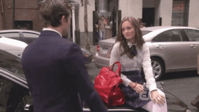 Woman Talking To Man With License Plate TNM GIF