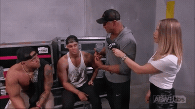 Woman Talking To Man With Microphone GIF