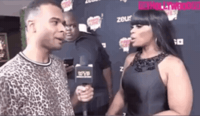 Woman Talking To Man With Microphone GIF