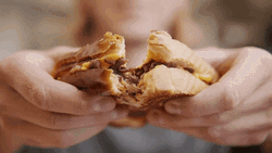 Woman Tearing Waffles With Chocolate Filling GIF
