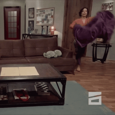 Woman Throwing Purple Blanket GIF