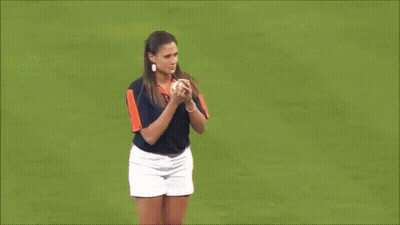 Woman Throws Ball On Baseball Field With Astros Mascot GIF