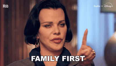 Woman Thumbs Up Saying Family First