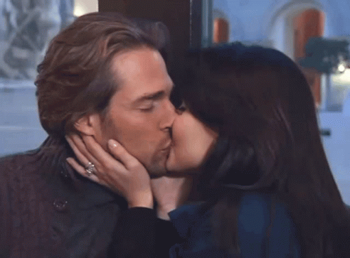 Woman Touches Man's Nose, Man Looks On GIF