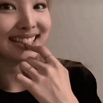 Woman Touching Chin With Ring GIF