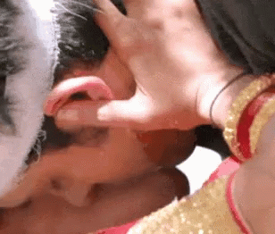 Woman Touching Man's Ear With Finger GIF