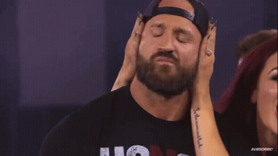 Woman Touching Man's Ear With Subscribe Tattoo GIF