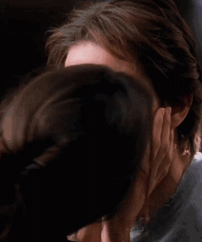 Woman Touching Man's Face GIF