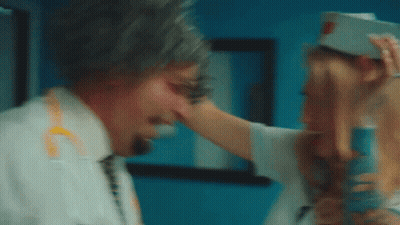 Woman Touching Man's Face In Hospital Room GIF