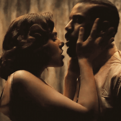 Woman Touching Man's Neck GIF