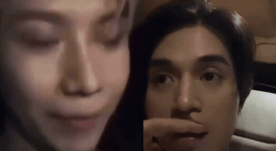Woman Touching Man's Nose Sitting Together GIF