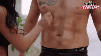 Woman Touching Shirtless Man's Stomach GIF