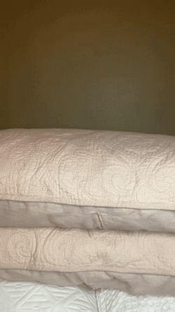 Woman Trying To Hide Under Cushions GIF
