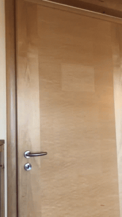 Woman Tying Blue Belt Around Waist GIF