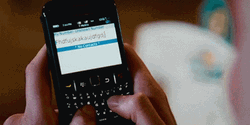 Woman Typing On BlackBerry Phone GIF