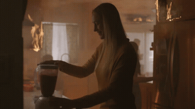 Woman Using Blender In Kitchen With Fire GIF