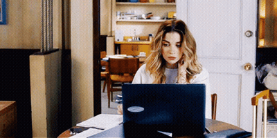 Woman Using Laptop With Microsoft Sticker GIF