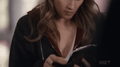 Woman Using Tablet In Front Of Window GIF