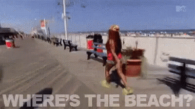Woman Walking Boardwalk Saying Where's The Beach GIF
