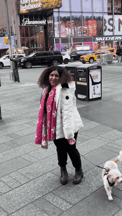 Woman Walking Dog In Front Of Paramount GIF