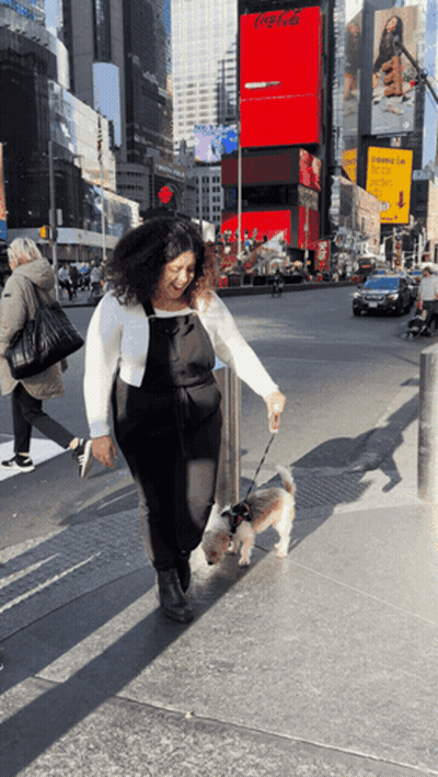 Woman Walking Dog Past Coca-Cola Sign GIF