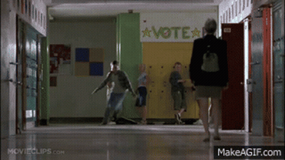 Woman Walking Down Hallway With Vote Sign GIF