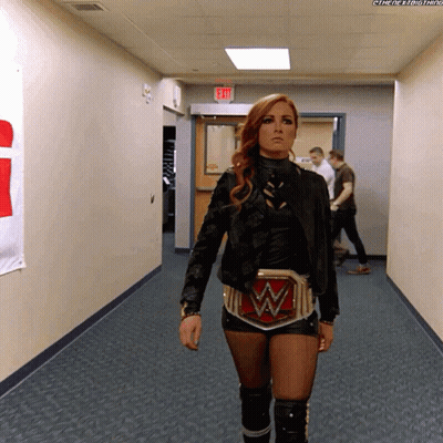 Woman Walking Down Hallway With W Belt GIF
