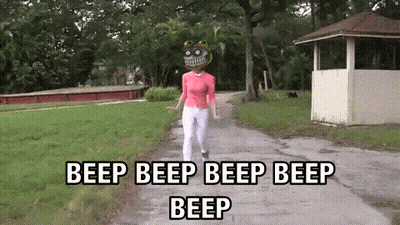 Woman Walking Down Path With Beep Beep Beep GIF
