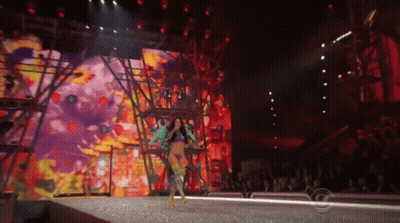 Woman Walking Down Runway At Fashion Show GIF