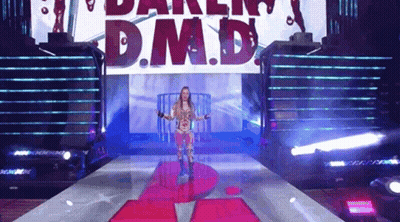 Woman Walking Down Stage With D M D Sign GIF