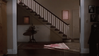 Woman Walking Down Stairs GIF