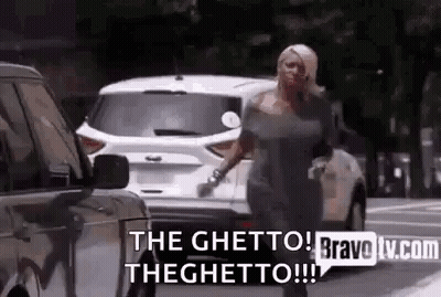 Woman Walking Down Street Talking On Cell Phone GIF