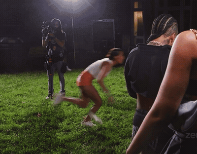 Woman Walking In Field With Zee On Shoulder GIF