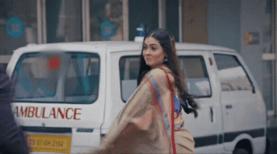 Woman Walking In Front Of Ambulance GIF