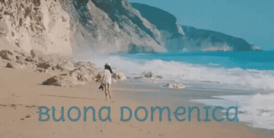 Woman Walking On Beach With Buona Domenica In Blue GIF