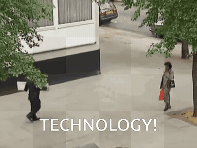 Woman Walking On Sidewalk Saying Technology GIF