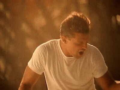 Woman Walking Past Stop Sign GIF