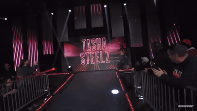Woman Walking Runway In Front Of Subscribe Screen GIF
