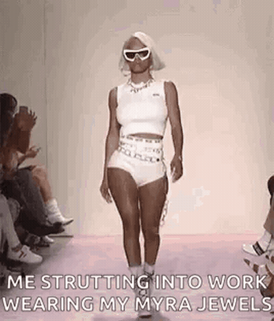 Woman Walking Runway In White Top And Shorts GIF